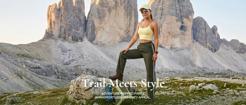 A woman in cargo trousers on a mountain path